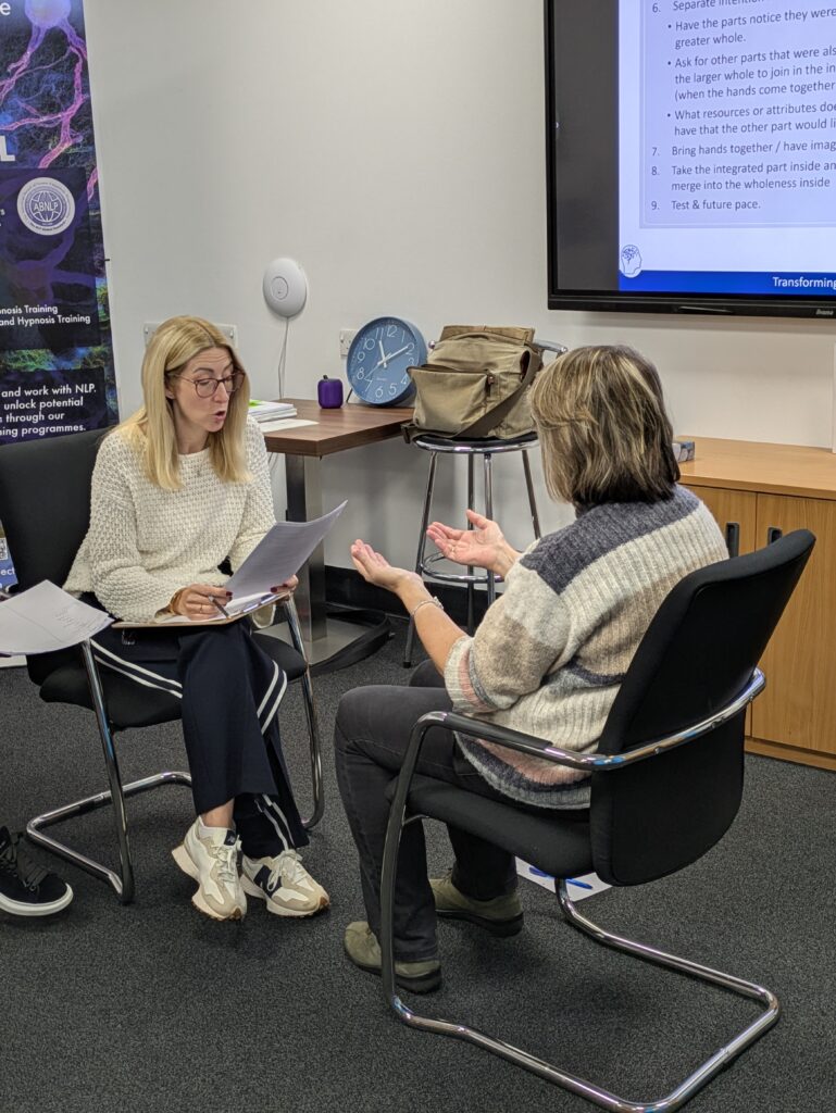 Practitioner Students working with each other on a parts integration
